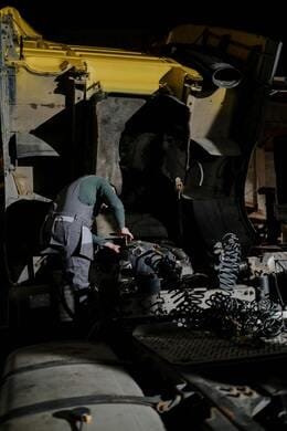 on Site Truck Suspension and Truck Air Leakage Repair in Montréal Est | Mtl Roadside Truck Trailers Repair Close Up of a Mechanic Completing Truck Suspension Repair on a Heavy Vehicle in Montréal Est | 247 Truck Repair in Montreal Est | Mobile Mechanics