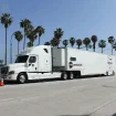 A mechanic is inspecting the Emergency Truck Suspension Repair system.